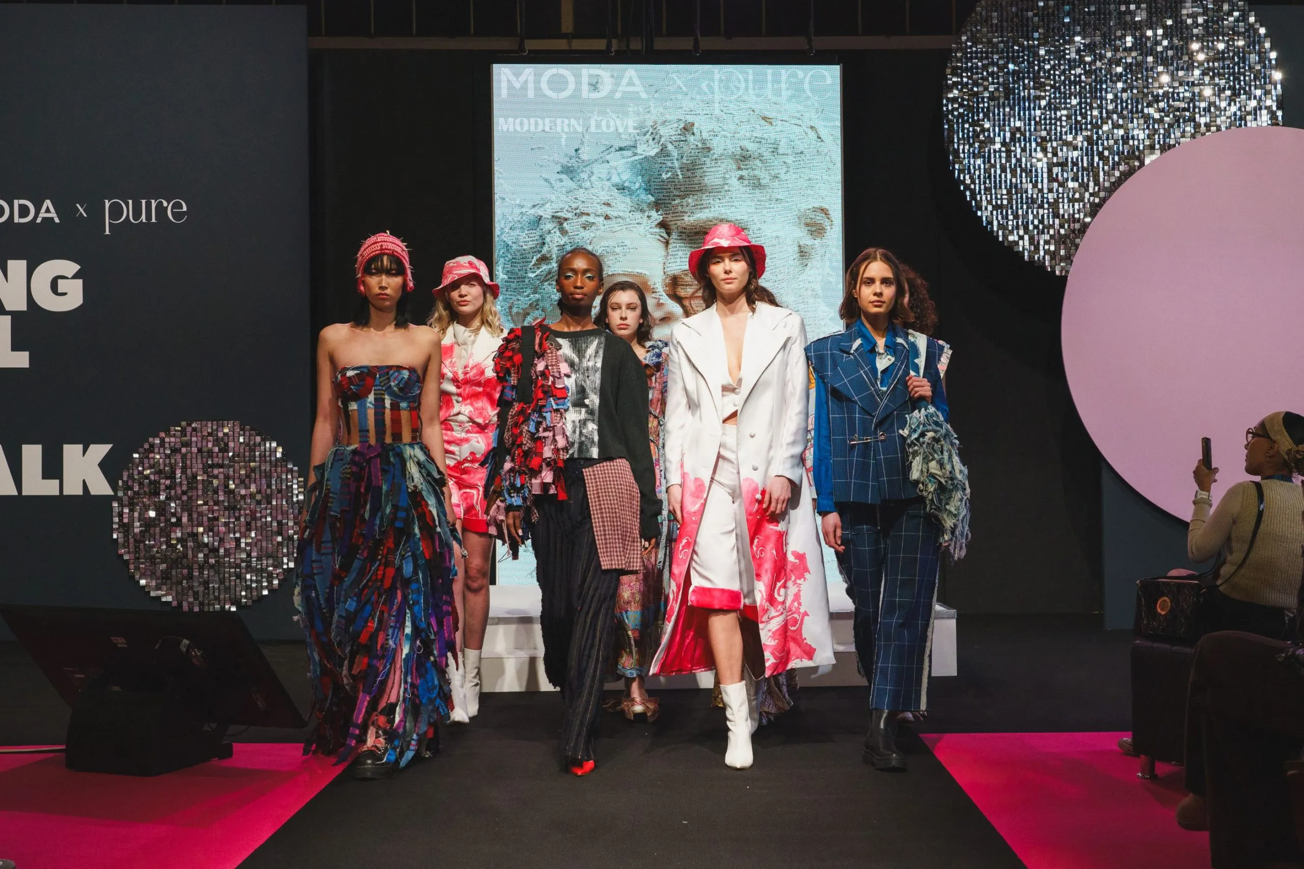 Upbeat mood at merged Moda x Pure