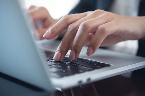 woman-typing-shutterstock_2381525721-492x328.webp