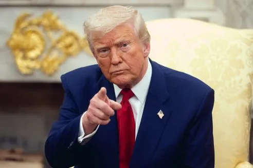 Donald Trump in White House pointing a finger