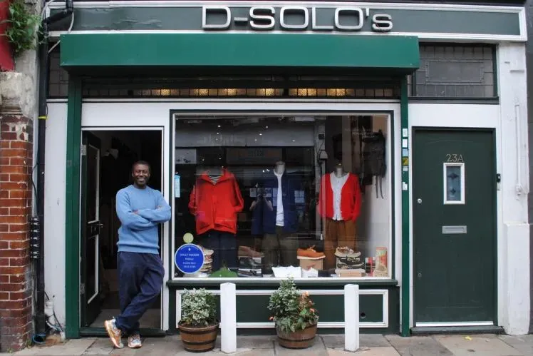 Dennis Brown D-Solos entrance blue sweater