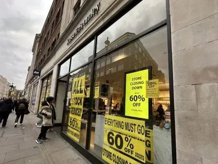 Russell & Bromley Covent Garden store with signs advertising clearance Sale