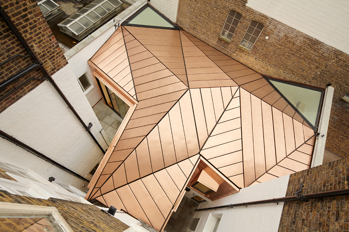 Emrys polishes off asymmetric copperroofed office