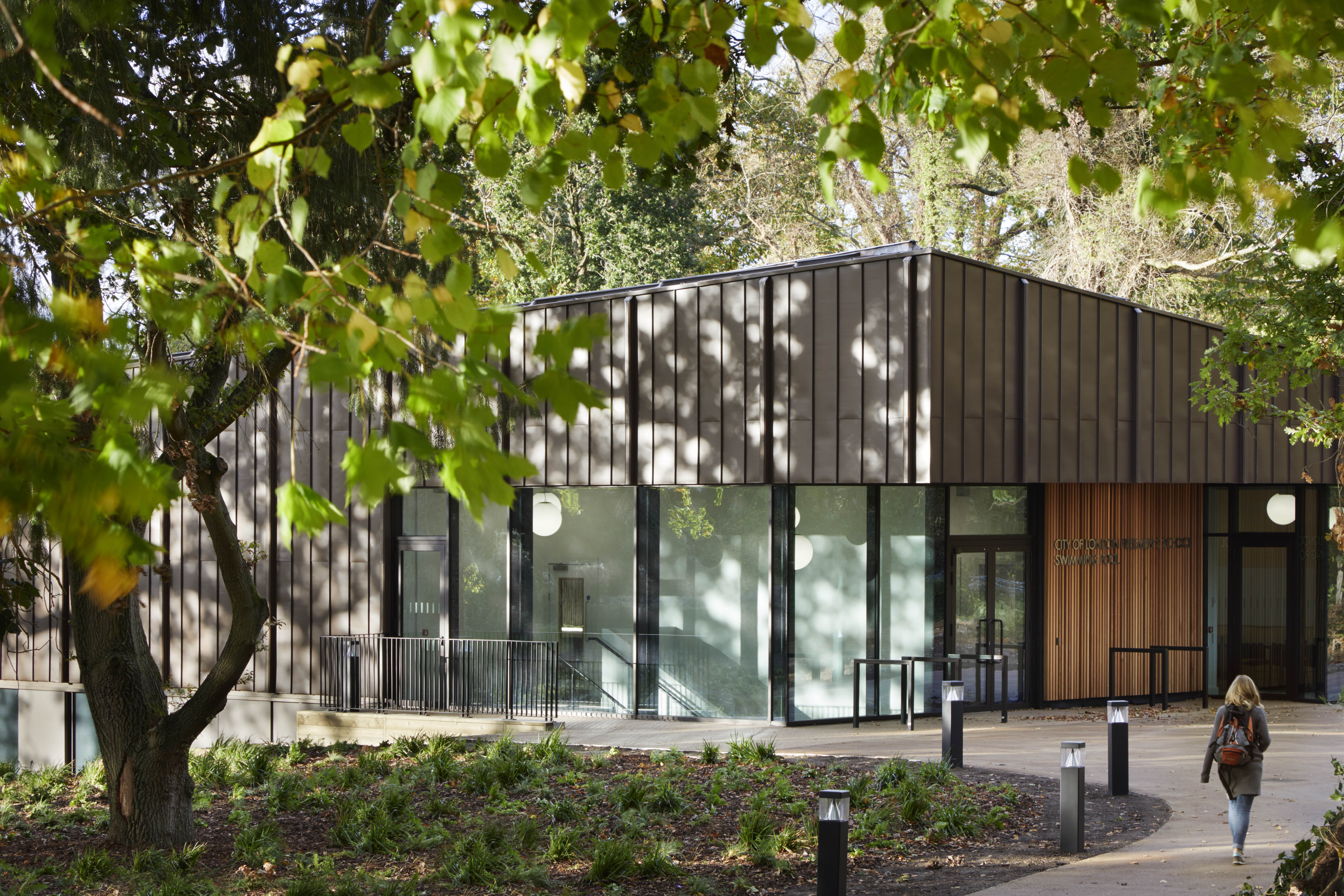 Hawkins\Brown completes engineered timber school swimming pool