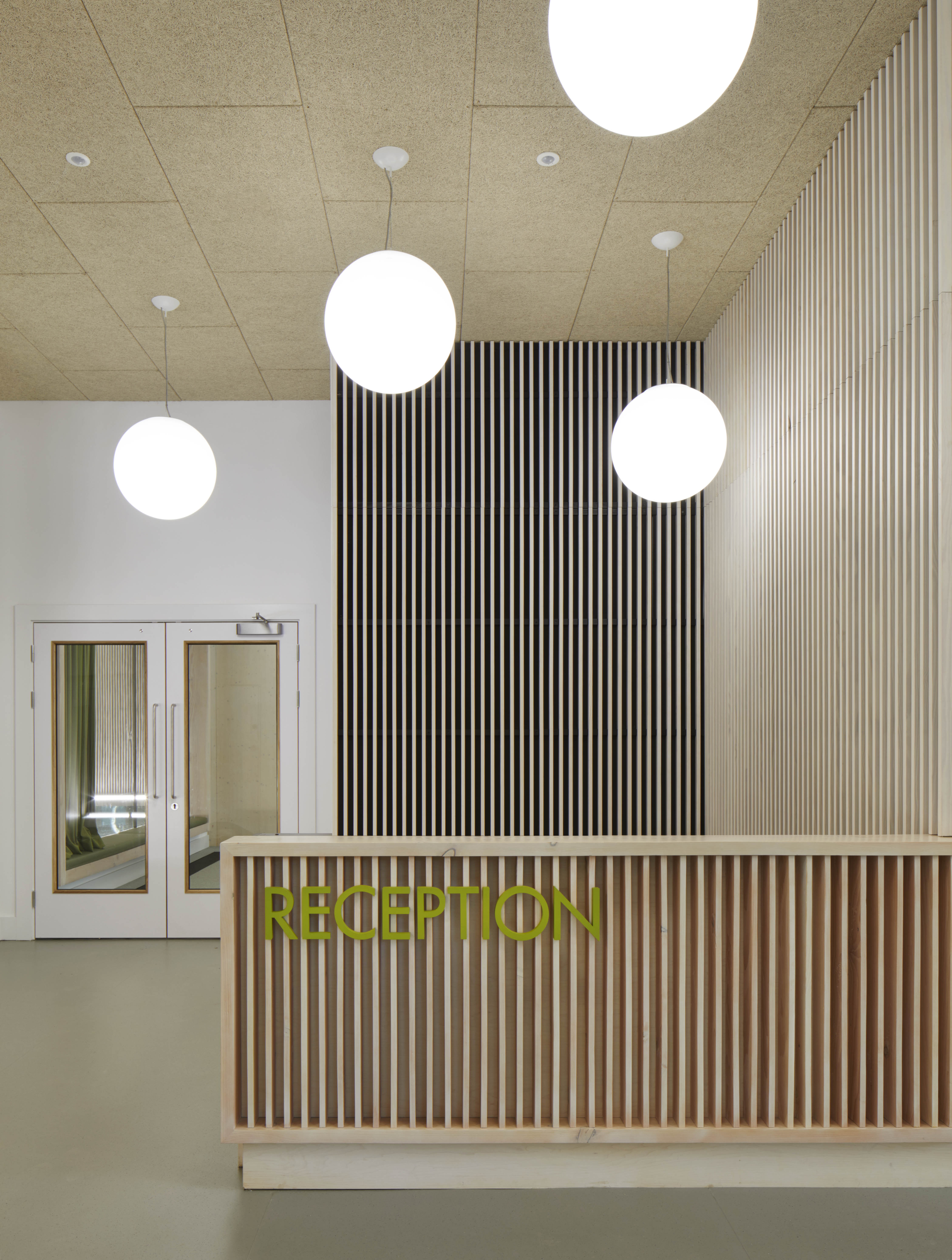 Hawkins\Brown completes engineered timber school swimming pool